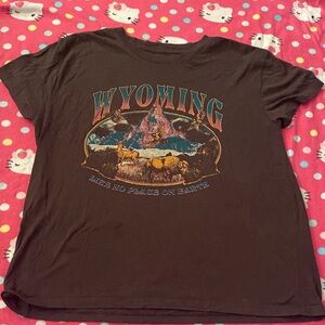 Mighty Fine Black T-shirt, Wyoming, Size large in kids, First women’s XS, or S